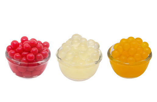 Red, white, orange bubbles or jelly pop in a glass cup,clipping path