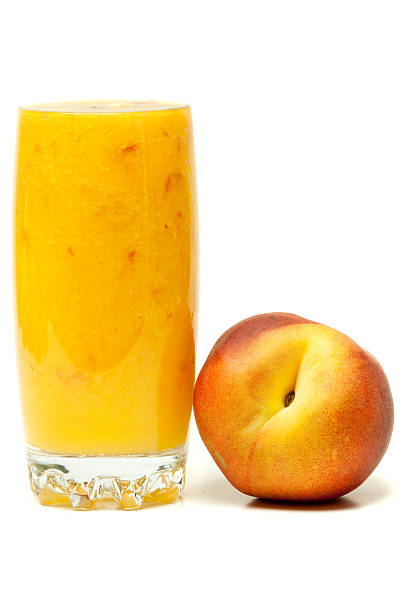 istock A peach and peach smoothie isolated on white 118260117