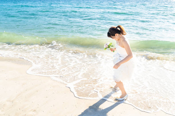 istock Bride in a seaside wedding mini dress 1182601829