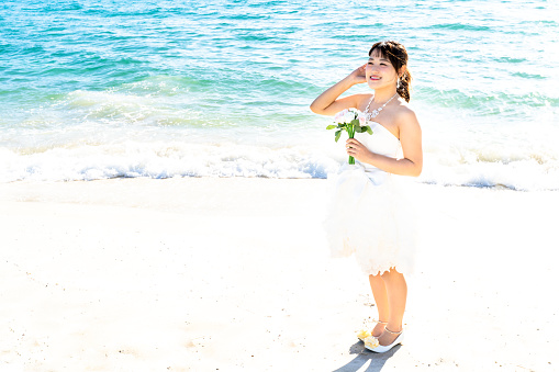 Bride in a seaside wedding mini dress