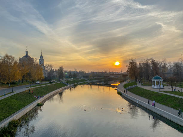 istock Panoramic sunset view of the river, promenade, old churches 1182602095
