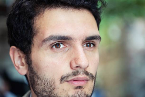 istock Closeup portrait of millennial man 1182603151