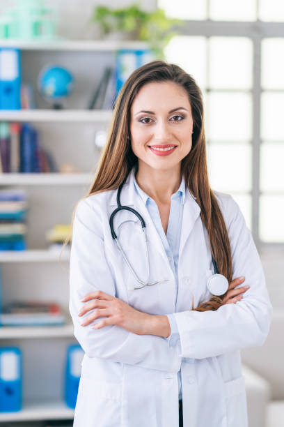 istock Smiling female doctor at her clinic 1182604453