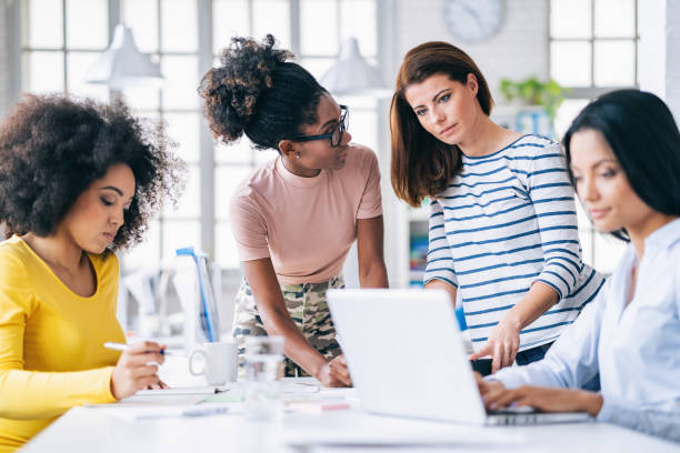 istock Multi-Ethnic women business team having discussion new projects 1182604523