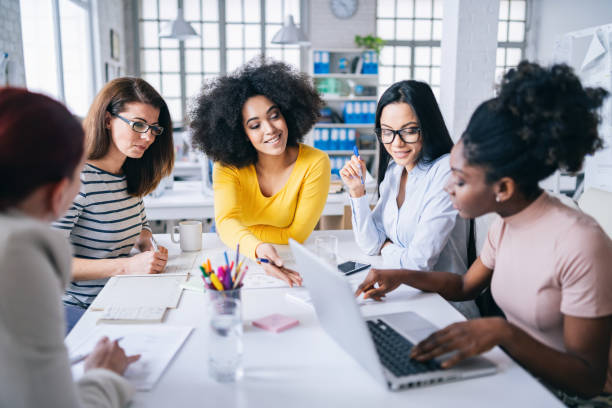 istock Multi-Ethnic women business team having discussion new projects 1182604526