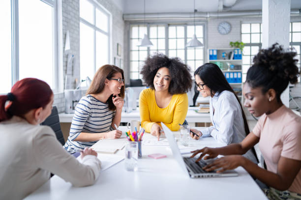 istock Multi-Ethnic women business team having discussion new projects 1182604535