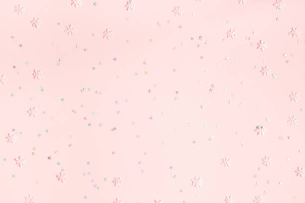 istock Christmas composition. Confetti, snowflake decorations on pastel pink background. Christmas, winter, new year concept. Flat lay, top view, copy space 1182604606