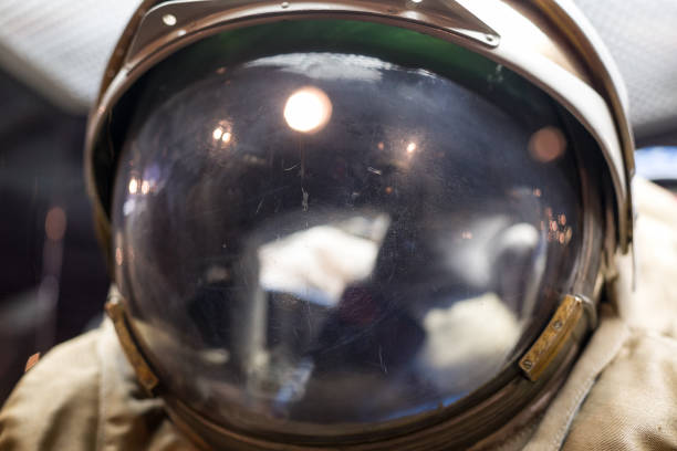 istock Closeup of a very old spaceman helmet with reflections. Outer space and exploring. 1182604671