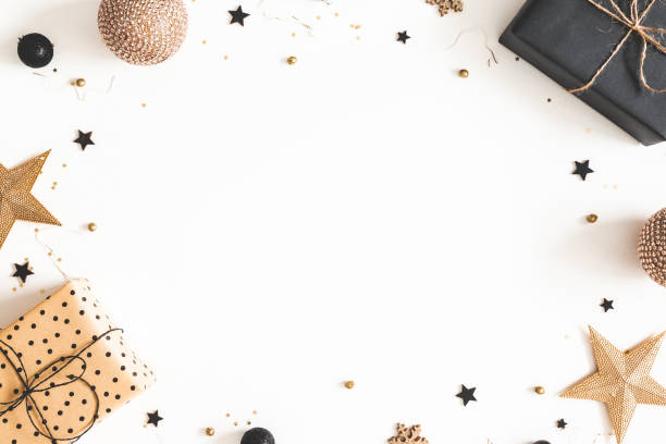 istock Christmas composition. Gift box, beige and black decorations on white background. Christmas, winter, new year concept. Flat lay, top view, copy space 1182605073