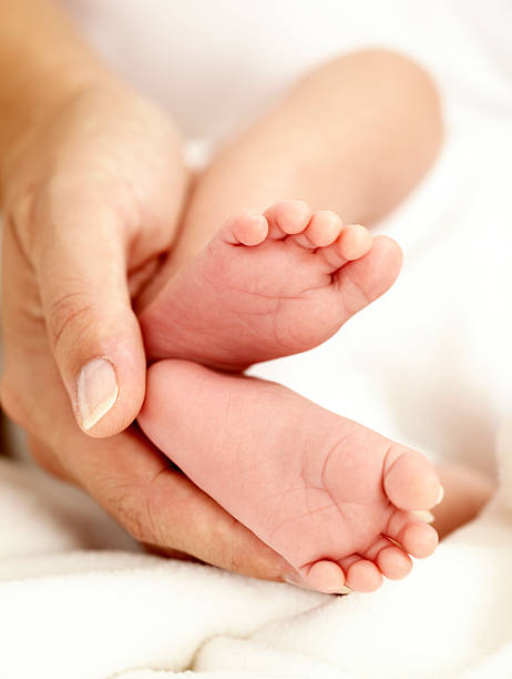 istock newborn baby feet 118260565