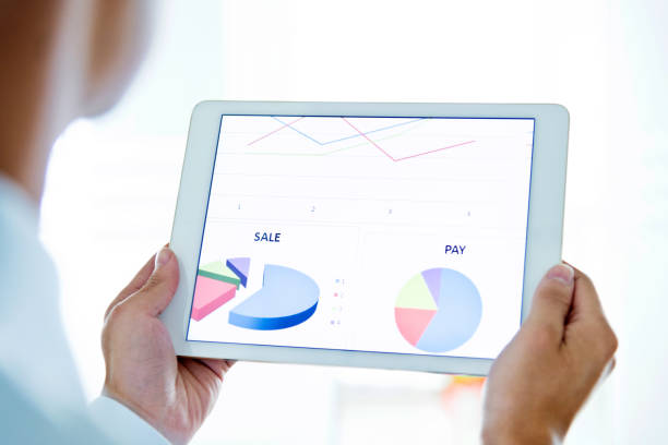 istock A businessman holding a digital tablet working 1182605848