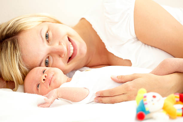 istock young mother with newborn baby 118260588