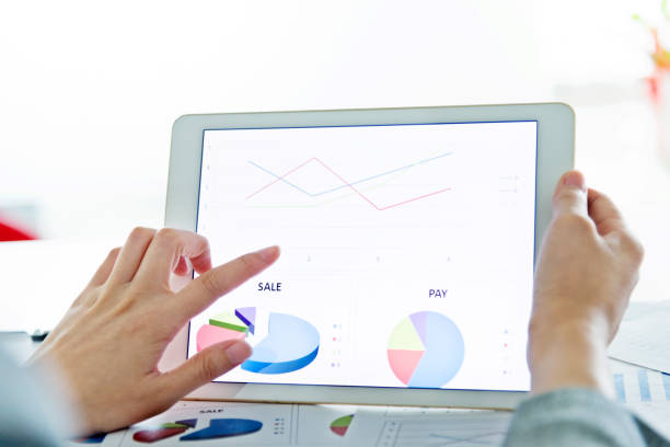 istock Businesswoman holding a digital tablet working 1182606033