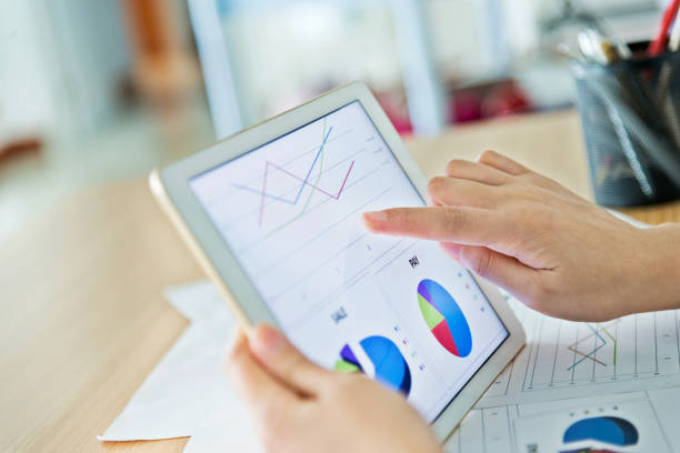 istock Businesswoman holding a digital tablet working 1182606113
