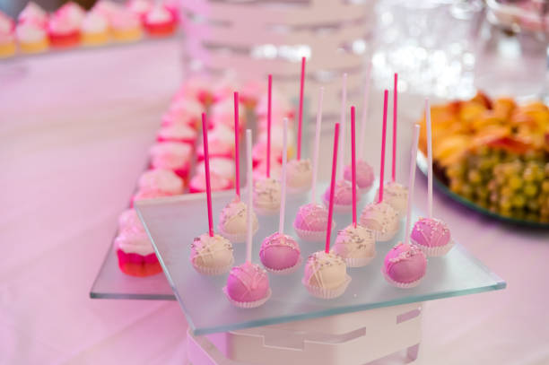 istock Dessert table with muffins, biscuits, macaroons, capcakes on a wooden background. 1182606297
