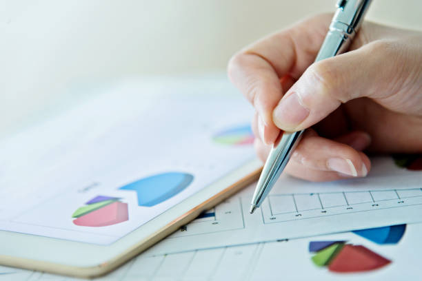 istock Businesswoman writing on the desk 1182606442