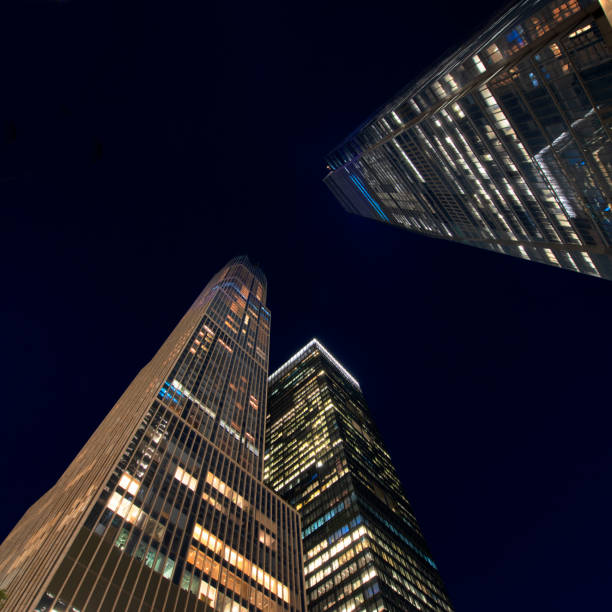 istock Buildings low angle view at night, New York City 1182608561