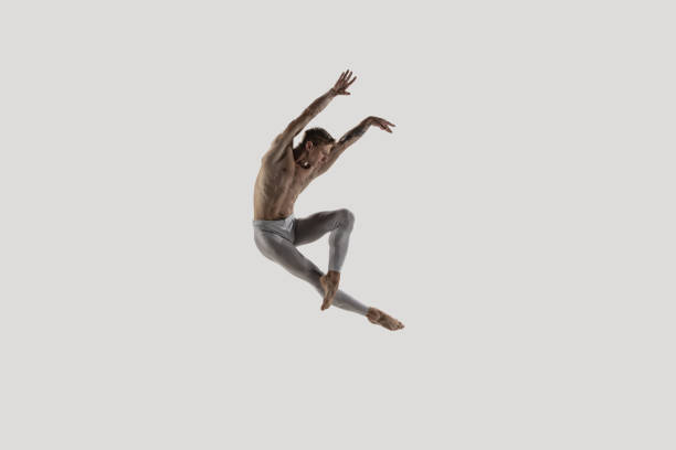 Modern ballet dancer. Contemporary art ballet. Young flexible athletic man. Modern ballet dancer. Contemporary art ballet. Young flexible athletic man.. Studio shot isolated on white background. Negative space. gir forest national park stock pictures, royalty-free photos & images