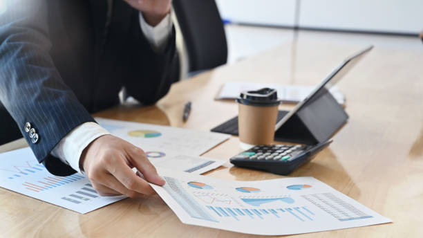 istock Contemplate business data, Closeup businessman analysis document finance data. 1182609770
