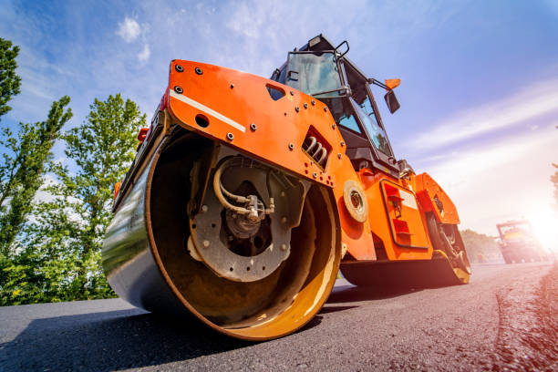 istock Road repair, compactor lays asphalt. 1182611428