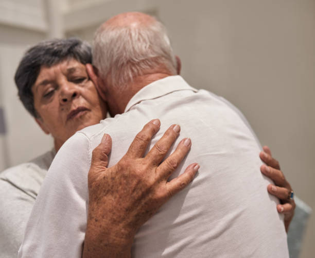 istock Content senior woman hugging her loving husband 1182612749