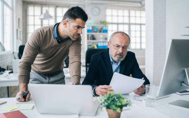 istock Senior male manager working with his colleague 1182614252