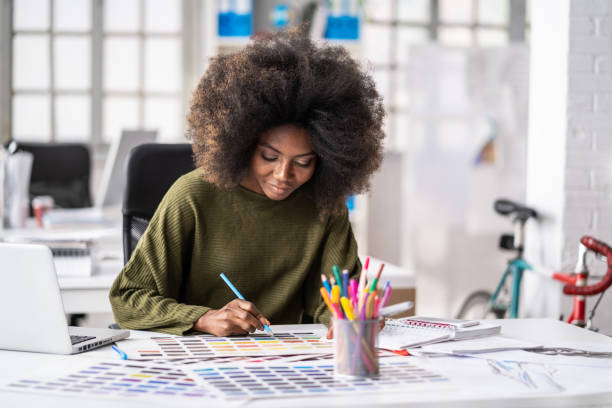 istock African Fashion designer working in studio 1182614575