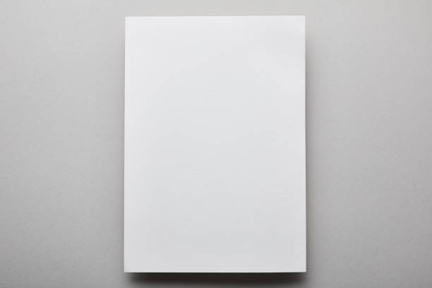 istock top view of empty and white paper with copy space 1182616595