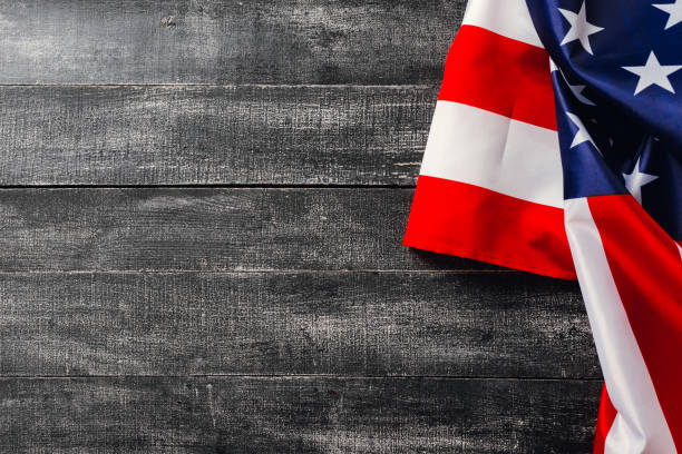 istock American flag on dark background. Flag Veterans Day Concept 1182617573