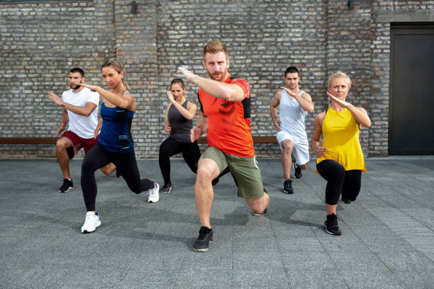 istock Group of people warming up for a workout 1182617733