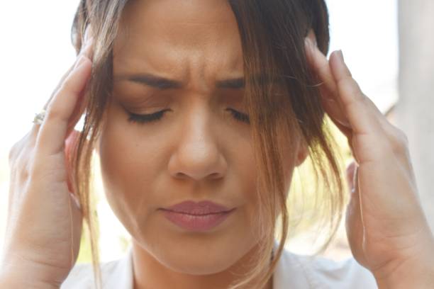istock Woman with headache 1182617788
