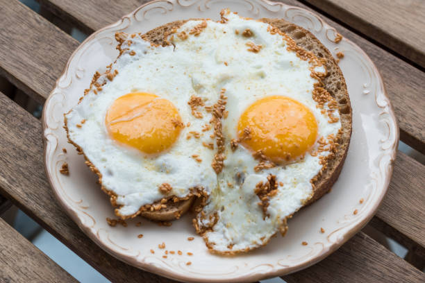 istock Fried Eggs with Sesame Seeds on Bread for Breakfast. 1182618027
