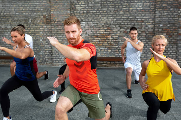 istock Group of people warming up for a workout 1182618721