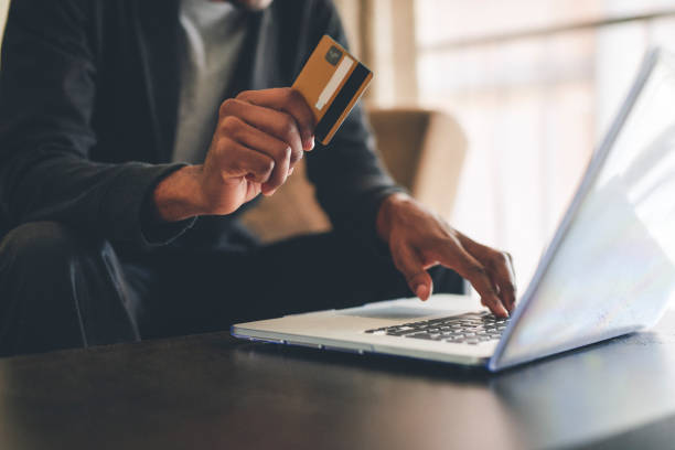 There are certain sales one cannot miss Cropped shot of an unrecognizable man using a credit card and a laptop to shop online at home expense photos stock pictures, royalty-free photos & images