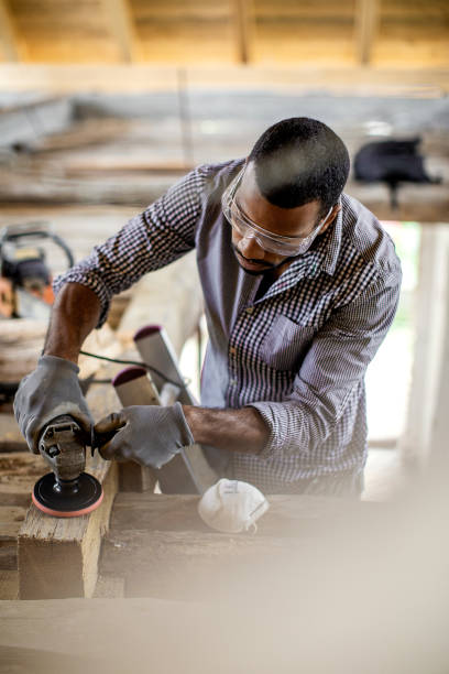 istock Young Man Renovating the Attic 1182624110