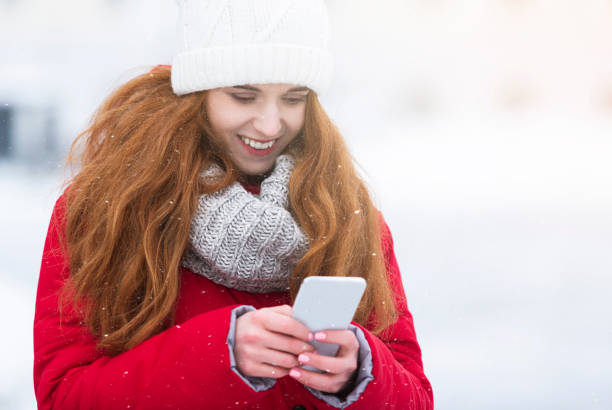 istock Cheerful young woman chatting with friends while walking 1182627547