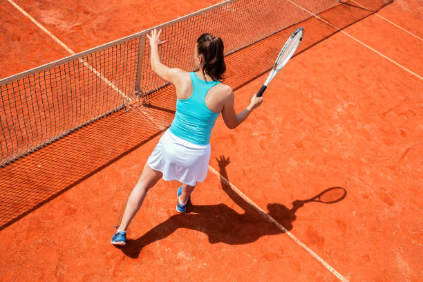 istock Female tennis player on the net 1182629828