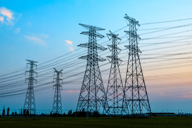 istock Electricity tower silhouette and sky landscape at dusk 1182629884