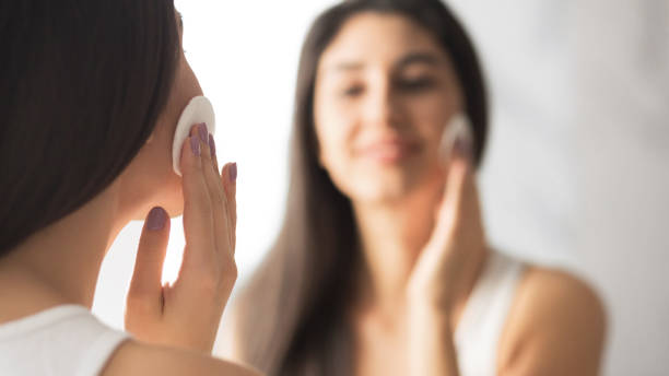 istock Unrecognizable Girl Using Cotton Pad Looking In Mirror Indoor, Panorama 1182630621