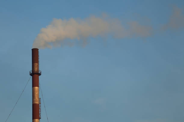 istock Smokestack against the sky 1182633512