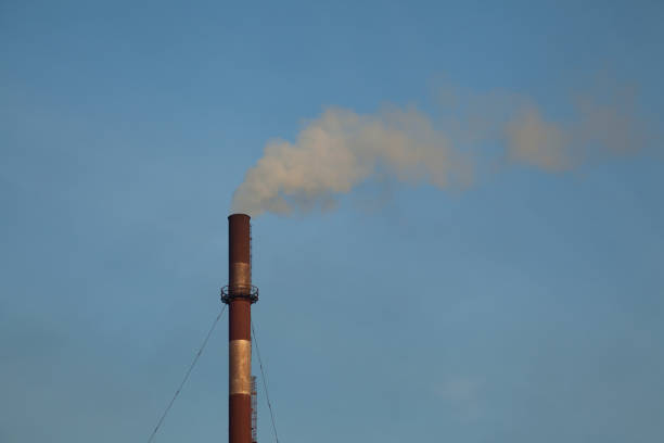 istock Smokestack against the sky 1182633529