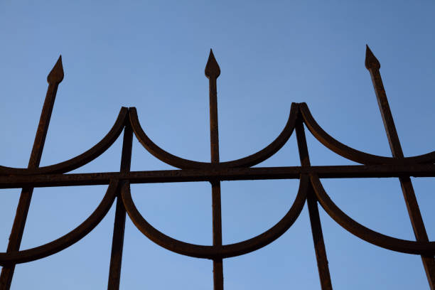 Forged fence Forged fence against the blue sky, close-up fence3 stock pictures, royalty-free photos & images