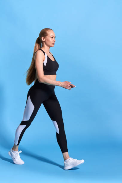 istock attractive slim sportswaoman going for a walk, 1182633535