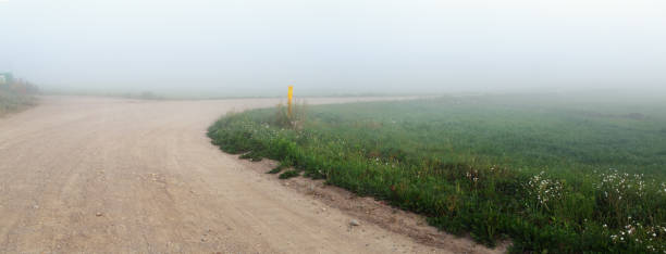 istock Road turning in the fog 1182633682
