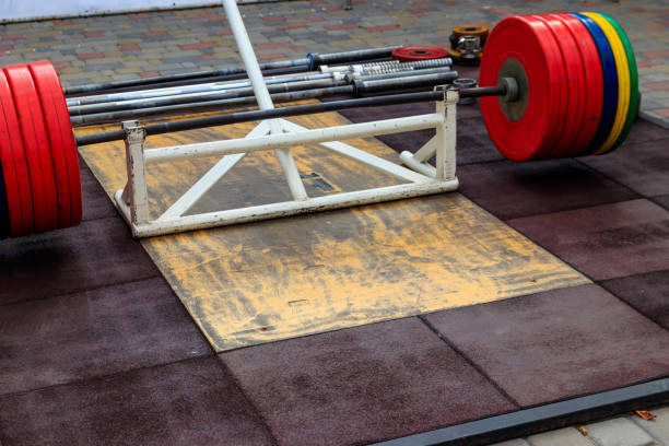 istock Barbell on the floor in gym 1182637302