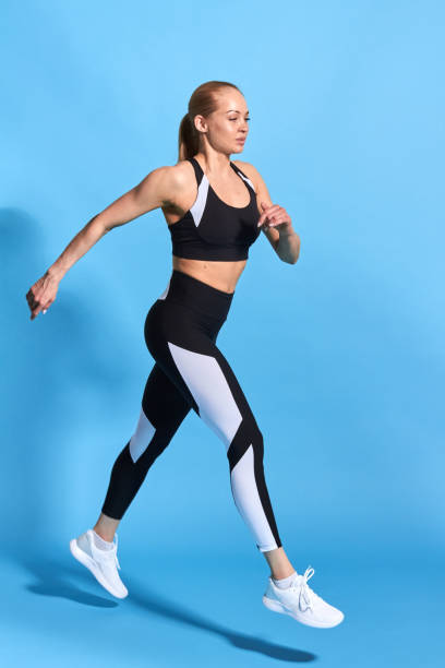 istock beautiful woman marching over blue background 1182637705