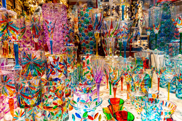 Coloured Venetian glass trinkets in shop Close-up window display of coloured Venetian glass gifts in a shop window in Venice . murano stock pictures, royalty-free photos & images