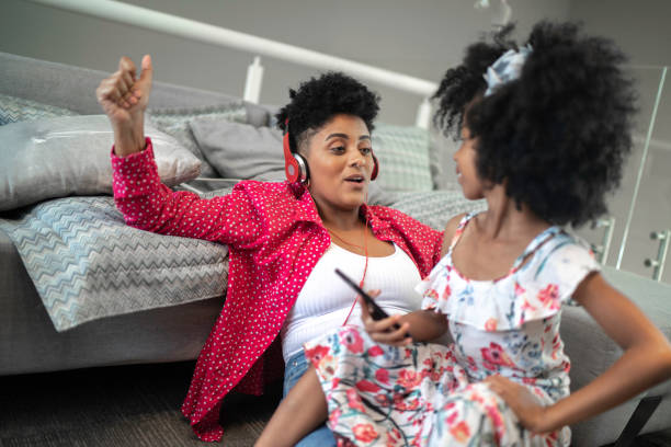 istock Sisters dancing and enjoying moment together 1182641782