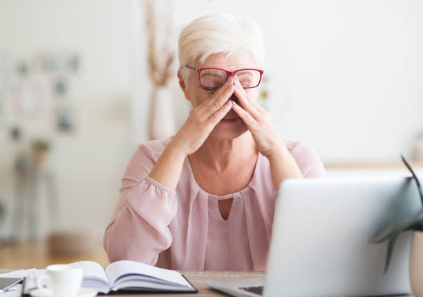 istock Old exhausted business woman feeling very tired 1182643320