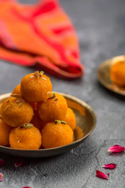 Motichoor Ladoo or Laddu - made from fine bundi, ball shaped sweets popular in indian subcontinent cooked with sugar, ghee or oil